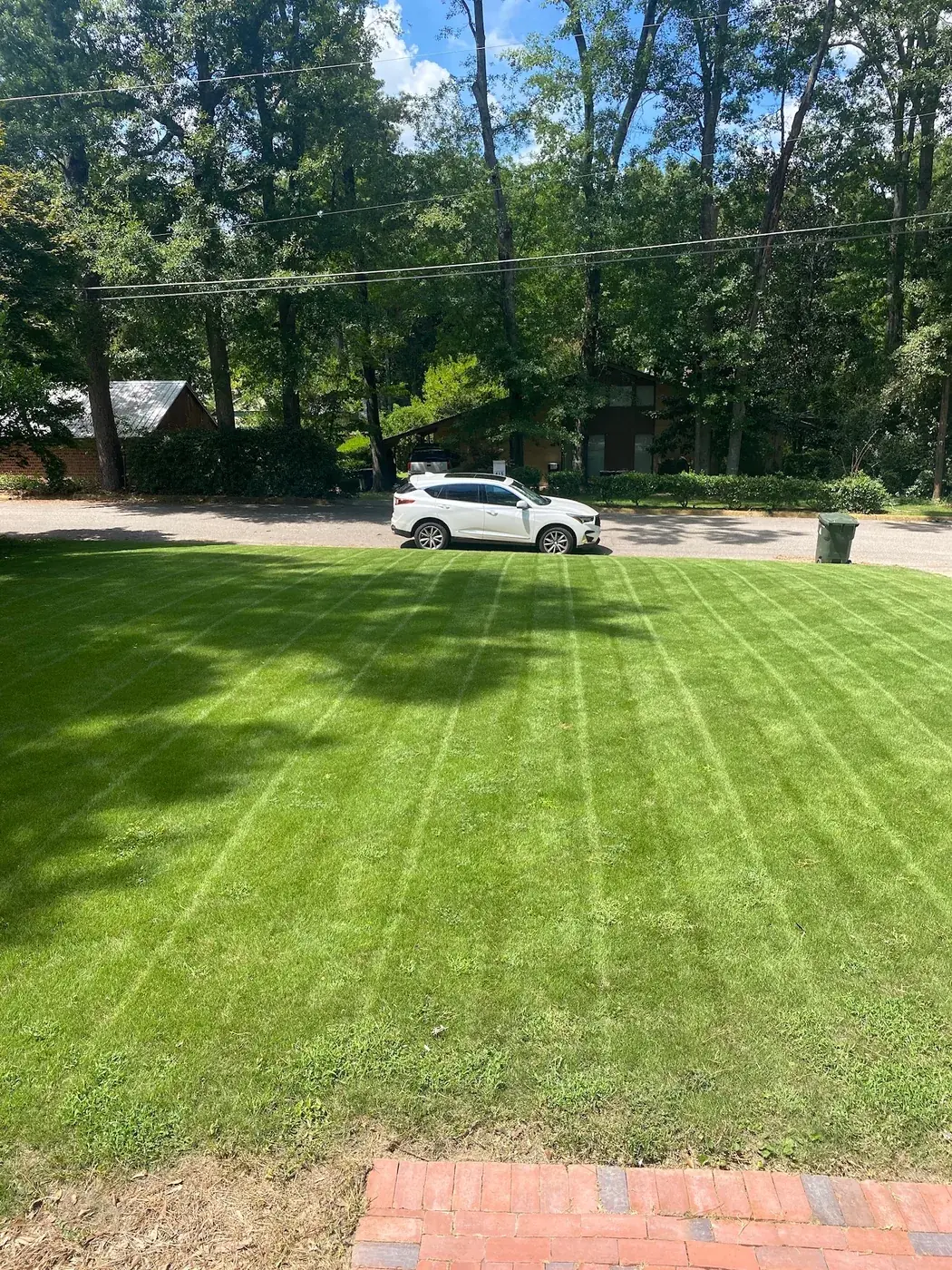 Fresh mowing stripes seen from a brick front porch